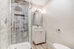Bathroom with shower, sink, and toilet