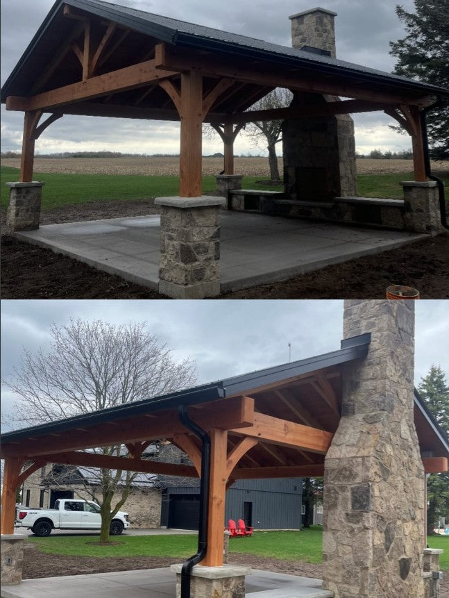 Wooden pavilion with stone pillars in a park setting
