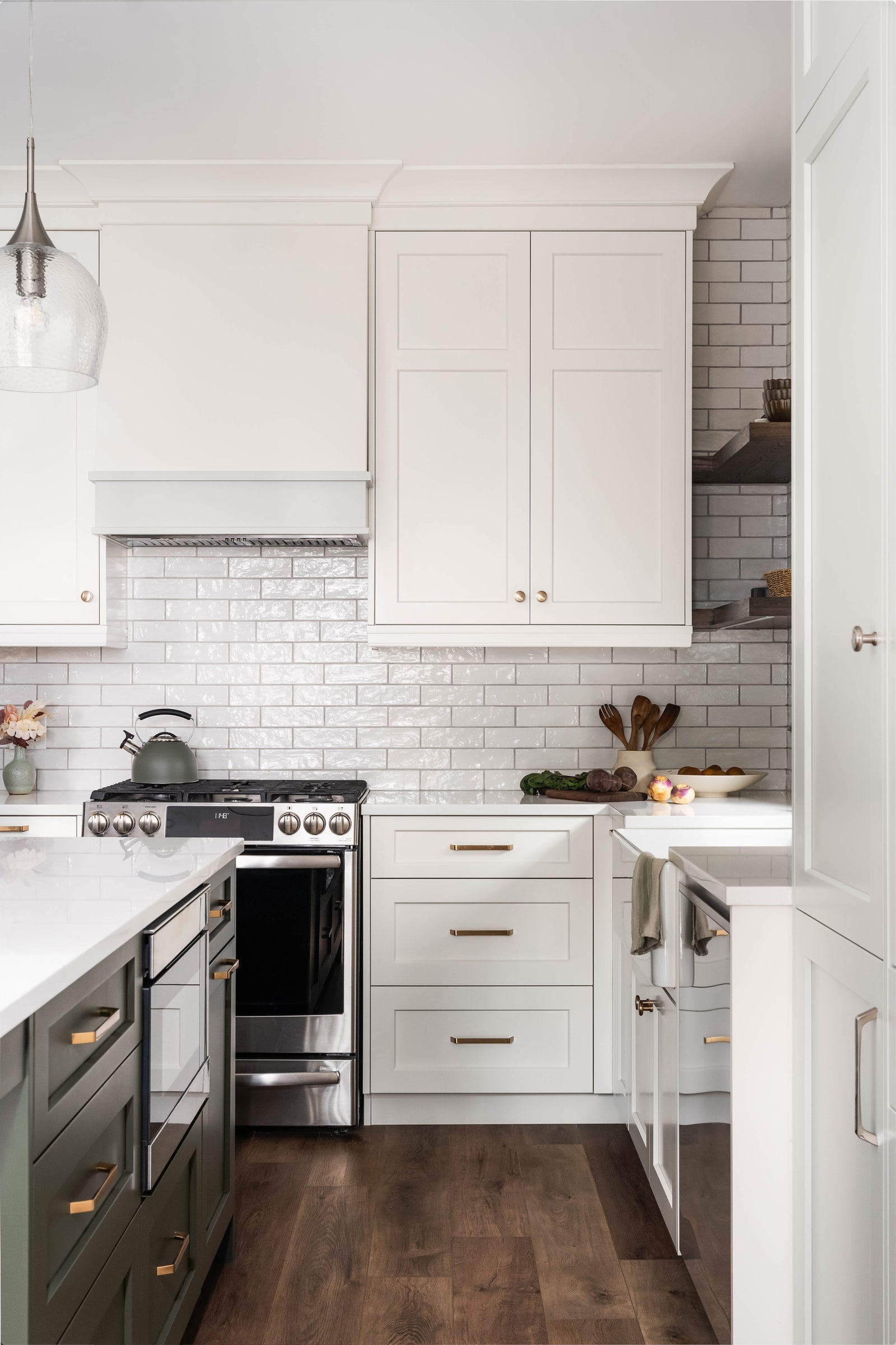 Modern kitchen with white cabinets, stainless steel appliances, and a subway tile backsplash.