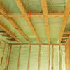 Spray foam insulation applied to the walls and ceiling of a construction site or existing building.